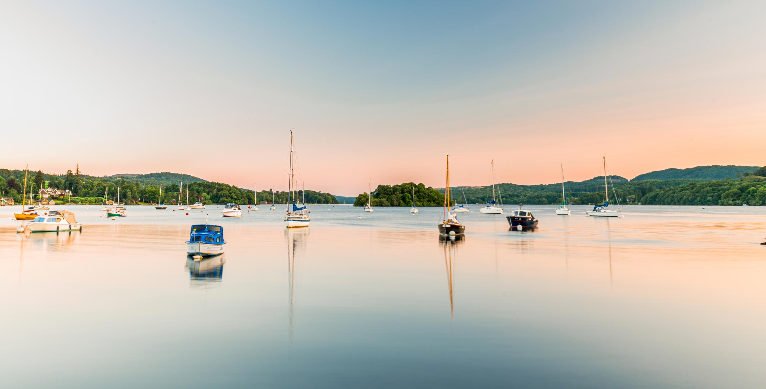 Landscape photograph of Lake Windermere at sunset.