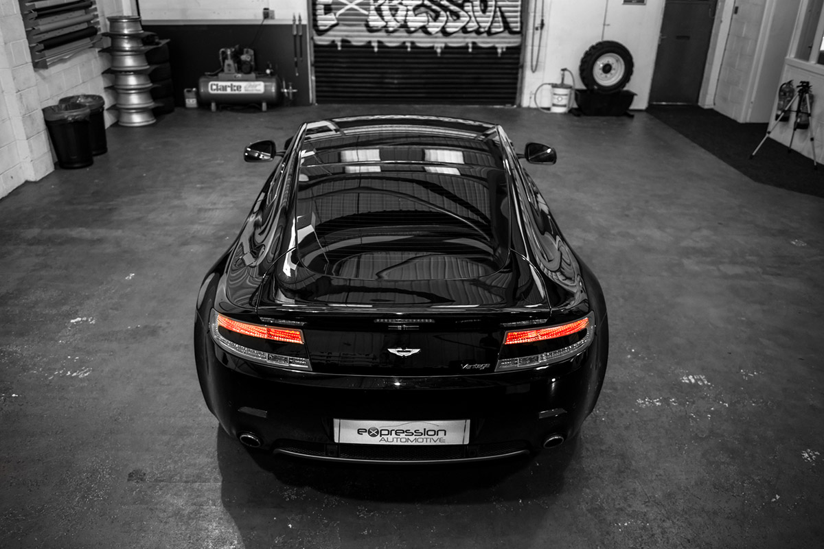 Aston Martin V8 Vantage with window tints inside a garage unit