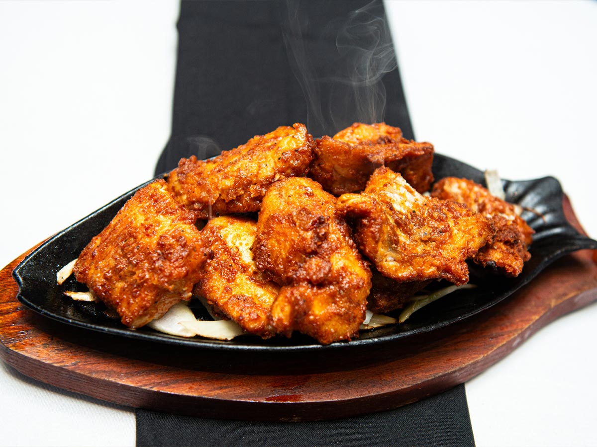 Steaming hot fish pakora on a plate